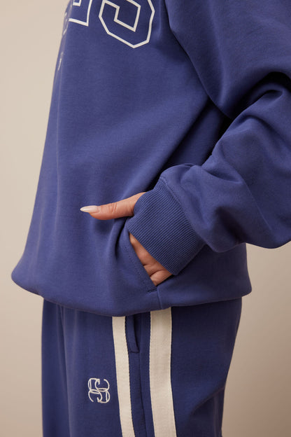 Isla Oversized Slouchy Crew in washed navy white heritage logo.