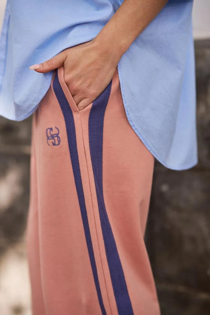 GIGI WIDE LEG TERRY TRACK PANT IN PINK CLAY WASHED NAVY SIDE STRIPE